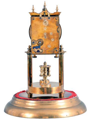 Germany, 400 day or anniversary clock, spring driven, torsion pendulum movement with disc pendulum in a polished brass case with cream porcelain dial under glass dome.