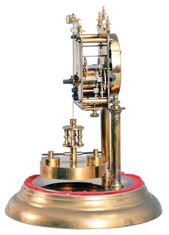 Germany, 400 day or anniversary clock, spring driven, torsion pendulum movement with disc pendulum in a polished brass case with cream porcelain dial under glass dome.