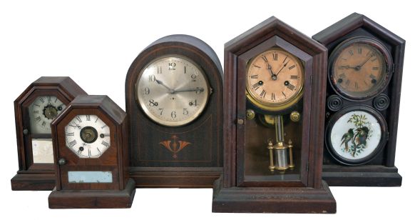 Clocks- 15 (Fifteen) American and European shelf clocks: including a Seth Thomas "Sonora" chime clock, two 30-hour cottage clocks, two Ingraham "Doric" clocks, a Junghans electro-mechanical clock, a brass-cased French clock sold by Tilden Thurber Co., a weight driven ogee clock, a sharp gothic clock, a French time-only mantel clock, a modern chiming bracket clock, two 30-hour clocks by Chauncey Jerome, a small pillar & scroll clock, and a wall clock by the Self-Winding Clock Company.