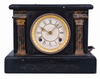 Loheide MFG. Co., St. Louis, Mo., "Automatic Sales Machine" clock and trade stimulator (often called a gambling clock). 8 day, time and token dispenser, spring driven in a black enameled wood case. The clock has a coin slot at the top. When a nickel was deposited, it triggered the strike train of the clock which drives a token dispensing system. A modified countwheel will dispense one, two, and on rare occasion, three tokens in the tray mounted to the side of the clock. Tokens were then exchanged for small items at the retail location.