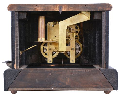 Loheide MFG. Co., St. Louis, Mo., "Automatic Sales Machine" clock and trade stimulator (often called a gambling clock). 8 day, time and token dispenser, spring driven in a black enameled wood case. The clock has a coin slot at the top. When a nickel was deposited, it triggered the strike train of the clock which drives a token dispensing system. A modified countwheel will dispense one, two, and on rare occasion, three tokens in the tray mounted to the side of the clock. Tokens were then exchanged for small items at the retail location.