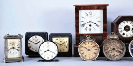 Clocks- 13 (Thirteen) American: two 19th century cottage models, plus later alarm clocks and desk timepieces. Alarms include 6 from WWII, "War Alarms" as printed on the dials, four of these are in square, hard molded paper mache cases with original black finish. 4 mixed nickel plated alarms (one in a carriage style case) and a mid century Westclox Big Ben.