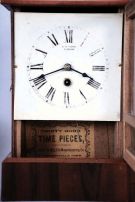 Clocks- 13 (Thirteen) American: two 19th century cottage models, plus later alarm clocks and desk timepieces. Alarms include 6 from WWII, "War Alarms" as printed on the dials, four of these are in square, hard molded paper mache cases with original black finish. 4 mixed nickel plated alarms (one in a carriage style case) and a mid century Westclox Big Ben.