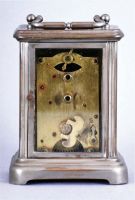 Clocks- 13 (Thirteen) American: two 19th century cottage models, plus later alarm clocks and desk timepieces. Alarms include 6 from WWII, "War Alarms" as printed on the dials, four of these are in square, hard molded paper mache cases with original black finish. 4 mixed nickel plated alarms (one in a carriage style case) and a mid century Westclox Big Ben.