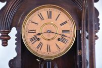 Ansonia Clock Co., New York, "Queen Isabella", 8 day, time and strike in a pressed and carved oak wall case.