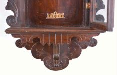 Ansonia Clock Co., New York, "Queen Isabella", 8 day, time and strike in a pressed and carved oak wall case.