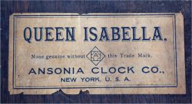 Ansonia Clock Co., New York, "Queen Isabella", 8 day, time and strike in a pressed and carved oak wall case.