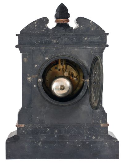 Marti & Cie, Paris, mantel clock, 8 day, time and strike, spring driven movement with visible Brocot escapement in an incised black slate case with red marble insets and molding, engraved sunk dial with black slate chapter ring with Roman numerals.
