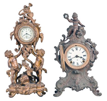 Clocks- 2 (Two): (1) Waterbury Clock Co., Waterbury, Conn., 30 hour, spring brass lever movement figural timepiece with brilliant surround dial, c1900; (2) Ansonia Clock Co., New York, "Cygnet", 8 day, time and strike, spring brass movement cast metal case with a figure on top mantel clock, c1904.