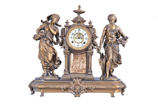 Ansonia Clock Co., New York, "Summer and Winter" 8 day, time and strike, spring brass movement figural mantel clock.