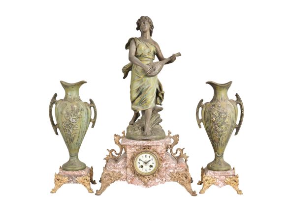 France, Variegated Pink Marble Figural Clock Garniture, the clock with off-white arabic numeral dial within a brass bezel and beveled glass set within the marble case with scroll work dial surround, on raised feet and and plinth for the statue titled "La Cigale" a sculpture first presented by Sylvain Kinsburger, the patinated figure of a young maiden no doubt playing the 