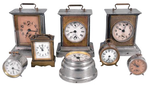 Clocks- 8 (Eight) Novelty and Musical Alarm Clocks: Clocks include models by Seth Thomas, New Haven, Waterbury, Sprague & Co., and Junghans. Standouts include a Waterbury "Hornet" 30 hour novelty timepiece and a small repeating "Kenwick" carriage clock by New Haven.