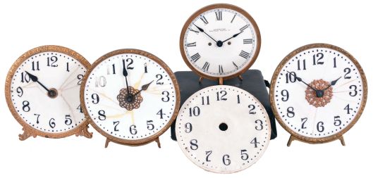 Clocks- 4 (Four) illuminated milk glass clocks, 30 hour, time only clocks, spring-driven balance wheel movements with 5 inch dials. One by the American Waltham Watch Co. comes in a velvet lined case. Of the other three, two are complete. An additional, unbroken dial is included in the lot.