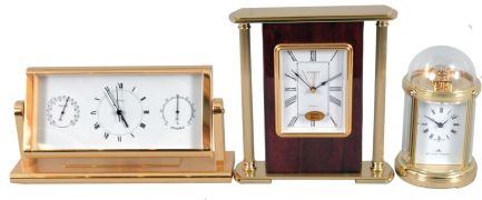 Clocks- 3 (Three) Fancy Modern Desk: (1) Mathew Norman, Switzerland, carriage clock, 8 day, time only, spring driven movement with visible balance wheel movement in a highly polished brass case with beveled glass sides and dome top; (2) Chelsea Clock Co., Boston, quartz clock with thermometer and hygrometer in polished brass case; (3) Linden, North Smithfield, RI, quartz table clock in a wood and metal case.