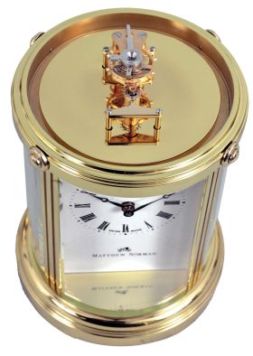 Clocks- 3 (Three) Fancy Modern Desk: (1) Mathew Norman, Switzerland, carriage clock, 8 day, time only, spring driven movement with visible balance wheel movement in a highly polished brass case with beveled glass sides and dome top; (2) Chelsea Clock Co., Boston, quartz clock with thermometer and hygrometer in polished brass case; (3) Linden, North Smithfield, RI, quartz table clock in a wood and metal case.