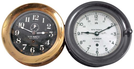 Clocks- 2 (Two) Seth Thomas Clocks for Navy: Seth Thomas Clock Co., Thomaston, Conn., for U.S. Navy, one "Deck Clock No. 1" and one other deck clock with 12/24 hour dial, 8 day, time only, spring-driven balance wheel movements, one in heavy brass case with screw-on bezel and the other in a black phenolic case with hinged bezel, both with 6 inch dials, one black and one silvered.