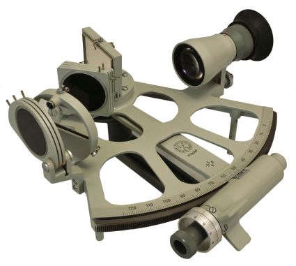 Veb Freiberger Prazisionmechanik, Germany, drum sextant,170mm radius, metal frame with gray finish, graduated arc reading from -5 to125, index arm with Freiberger logo, micrometer drum vernier adjustment, multiple shades for horizon and index mirrors, 4x power sighting scope, metal handle, all in a wood box with instruction booklet and certificate under the lid dated 1977.