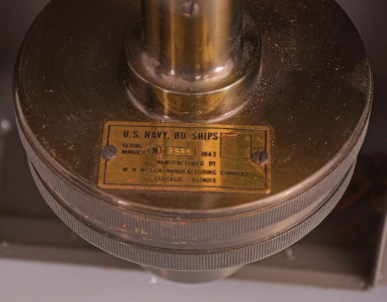 Barometers- 2 (Two) World War II era gimbal-mounted mercurial barometers for U.S. Navy Bureau of Ships: (1) Julian P. Friez, Baltimore, Maryland, brass body, mounted in a gray painted brass box, Navy tag dated 1942. (2) W. M. Welch Scientific Company, Chicago, Illinois, brass body with thermometer, mounted in a gray painted copper box, Navy tag dated 1943.