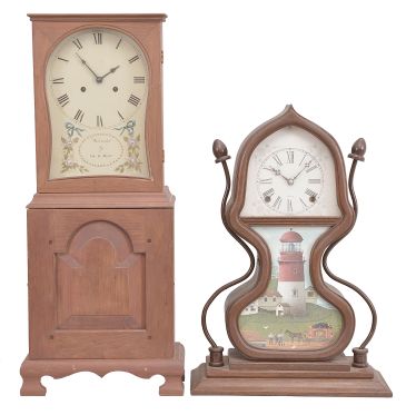 Clocks- 2 (Two): (1) Unknown, Mass.-style shelf clock reproduction, 8 day, time and strike, spring driven German movement in a handmade pine case, c1980; (2) Unknown, reproduction of acorn shelf clock originally produced by Forestville Manufacturing Co., 8 day, time and strike, spring driven movement in a walnut case, c1990.