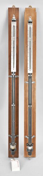 Barometers- 2 (Two): Sargent-Welch Scientific Co., Skokie, Illinois, "U.S. Weather Bureau Type" Fortin-style mercurial barometers, polished nickel-silver engine divided scales showing both inch and centimeters with vernier plates, thumbscrew adjustment below cistern for zeroing, fixed to wood backboards for wall mounting.