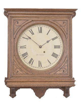 Seth Thomas Clock Co., Thomaston, Conn., "Office No. 5" wall clock, 8 day, time only, spring driven movement in an oak case with 12 inch papered metal dial, blued steel spade hands.