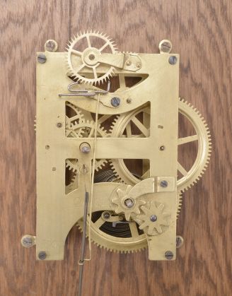 Seth Thomas Clock Co., Thomaston, Conn., "Office No. 5" wall clock, 8 day, time only, spring driven movement in an oak case with 12 inch papered metal dial, blued steel spade hands.
