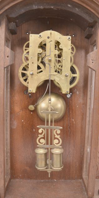 Ansonia Clock Co., New York, NY, "Broadway" shelf clock, 8 day, time and strike, spring driven movement in a walnut and burled walnut veneer case with carved elements.