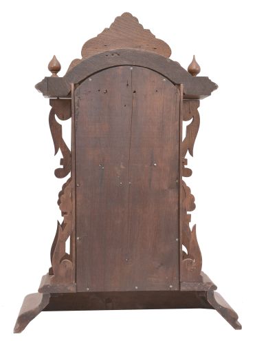 Ansonia Clock Co., New York, NY, "Broadway" shelf clock, 8 day, time and strike, spring driven movement in a walnut and burled walnut veneer case with carved elements.