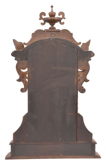 Ansonia Clock Co., New York, "Fifth Avenue", 8 day, time and strike, spring driven movement in a walnut and walnut burl veneer case with carved elements.