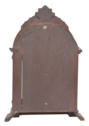E.N. Welch, Forestville, Conn., unknown model, 8 day, time and strike, spring driven movement in a walnut case with full carved columns.