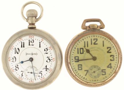 Pocket watches- 2 (Two): Both 18 size Illinois "Bunn Special", the first with damascened nickel movement marked "23 Ruby Jewels", Gothic Arabic numeral white enamel dial, silverode open face case, serial #2396486, the other with damascened nickel movement marked "21 Ruby Jewels", Arabic numeral metal dial, gold filled open face case, serial #1580165