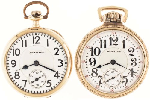 Pocket watches- 2 (Two): Both 16 size Hamilton, the first a "952", 19 jewel nickel movement, Arabic numeral white enamel dial, gold filled swingout case, serial #840055, the other a "992", 21 jewel nickel movement, Arabic numeral white enamel dial, gold filled open face case, serial #2387269