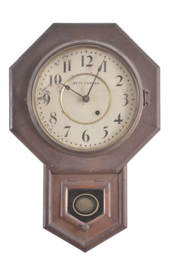 Clocks- 3 (Three): (1) New Haven Clock Co., New Haven, Conn., "Willard" banjo clock, 30 day, time and strike, spring driven movement in a mahogany case, c1911; (2) Ansonia Clock Co., New York, "Modern" mirror clock, 8 day, time only, spring driven movement with lever escapement, c1923; (3) Seth Thomas Clock Co., Thomaston, Conn., "10 Inch Drop Octagon", 8 day, time only, spring driven movement in a oak case, c1917.