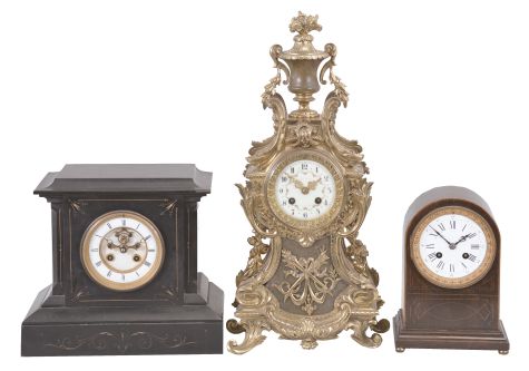 Clocks- 3 (Three) French: lot includes three mantel clocks, 8 day, time and strike, spring driven pendule de Paris movements in cases of mahogany, black slate, and cast brass, all with white enamel dials.