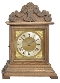 Clocks- 2 (Two) (1) William L. Gilbert Clock Co., Winsted, Conn., "No. 414", 8 day, time and strike spring brass movement porcelain mantel clock; (2) Ansonia Clock Co., New York, "Cabinet No. 51" mantel clock, 8 day, time and strike, spring driven movement in an oak case, brass dial with silvered chapter ring and cast spandrels, c1914.