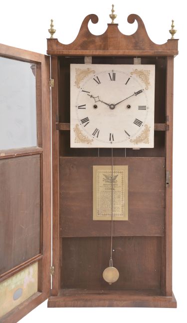 Merriman, Birge & Co., Bristol, Conn., 30 hour, weight wood movement with roller pinions reeded pilaster & scroll top shelf clock.