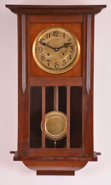 Clocks- 2 (Two): (1) German, 8 day, time and strike spring brass movement wall clock. Movement is stamped "PSI ". c1910 (2) New Haven Clock Co., New Haven, Conn., "Vamoose", 8 day, spring brass movement wall timepiece. c1911