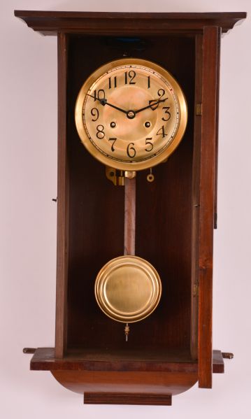 Clocks- 2 (Two): (1) German, 8 day, time and strike spring brass movement wall clock. Movement is stamped "PSI ". c1910 (2) New Haven Clock Co., New Haven, Conn., "Vamoose", 8 day, spring brass movement wall timepiece. c1911