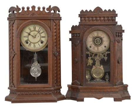 Clocks- 2 (Two): (1) Waterbury Clock Co., Waterbury, Conn., "Granville" mantel clock, 8 day, time and strike, spring driven movement in a walnut case, c1886; (2) Wm. L. Gilbert, Winsted, Conn., "Altai" mantel clock, 8 day, time and strike with alarm, spring driven movement in a walnut case, c1885;