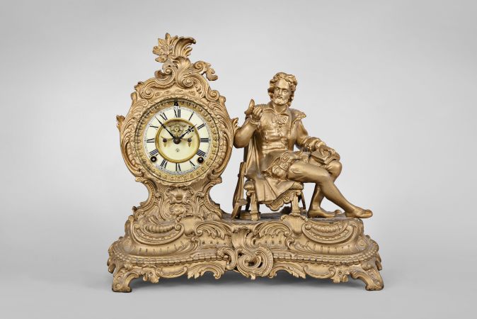 Clocks- 6 (Six): (1) Seth Thomas steeple clock with German movement, 8 day, time and strike movement in an ash case, c1960; (2) Miniature acorn clock with German movement, time only, c1970; (3) Seth Thomas mantel clock, 8 day, time and strike, 120 movement in an Art Deco style wood case, c1930; (4) Ansonia Clock Co., "Arion" figural mantel clock, 8 day, time and strike, visible Brocot escapement, c1894; (5) and (6) Horolovar Co., New York, "Ignatz", flying pendulum novelty timepieces.