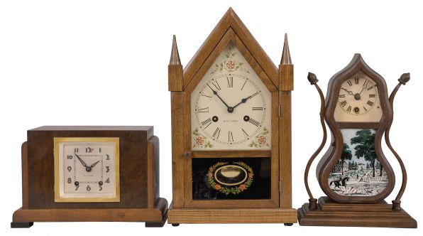 Clocks- 6 (Six): (1) Seth Thomas steeple clock with German movement, 8 day, time and strike movement in an ash case, c1960; (2) Miniature acorn clock with German movement, time only, c1970; (3) Seth Thomas mantel clock, 8 day, time and strike, 120 movement in an Art Deco style wood case, c1930; (4) Ansonia Clock Co., "Arion" figural mantel clock, 8 day, time and strike, visible Brocot escapement, c1894; (5) and (6) Horolovar Co., New York, "Ignatz", flying pendulum novelty timepieces.