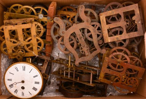 Parts- 16 (Sixteen) Brass Movements: assorted American clock movements, most time and strike, with some 8 day spring driven movements, and many 30 hour weight driven movements by makers including Waterbury and Gilbert. One British lyre form movement is stamped "The Caledonian Registered ". Also included is a French time only movement by Japy Freres as well as more than 20 old pendulum bobs.