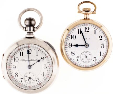Pocket watches- 2 (Two): The first a Hampden "North American Railway", 18 size, 21 jewel damascened nickel movement, Montgomery Arabic numeral white enamel dial, heavy, coin silver swing out case, serial #3154585, the other an Elgin "Veritas", 18 size, 23 jewel damascened nickel movement, Montgomery arabic numeral white enamel dial, gold filled open face case, serial #15475741