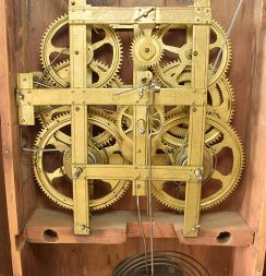 An old shelf clock case, perhaps Colonial Revival or earlier, now fitted with a Birge, Mallory & Co., Bristol, Conn., 8 day, time and strike weight strap brass movement, c1840.