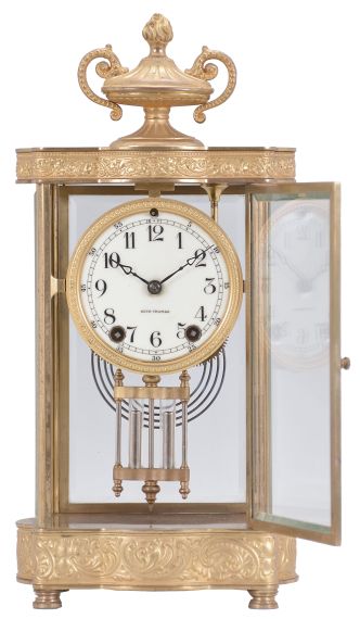 Seth Thomas Clock Co., Thomaston, Conn., "Empire No. 7" crystal regulator, 8 day, time and strike, spring driven movement in a glazed gilt brass case with urn finial, cream porcelain dial and blued steel hands.