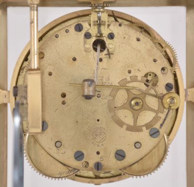 Seth Thomas Clock Co., Thomaston, Conn., "Empire No. 7" crystal regulator, 8 day, time and strike, spring driven movement in a glazed gilt brass case with urn finial, cream porcelain dial and blued steel hands.